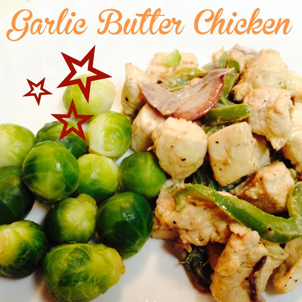 Homepage hero: Bite-sized garlic butter chicken with sautéed green peppers and red onion beside steamed Brussels sprouts on a white plate, orange script title overlay